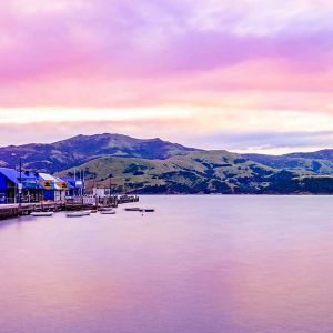 Akaroa Harbour and Wharf with beautiful pink sky. Copyright: christchurchnz.com
