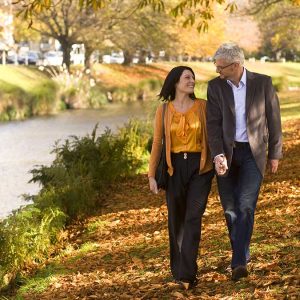 Couple enjoying an Autumn walk along the Avon River. Copyright: christchurchnz.com