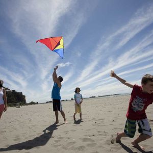 Family flying a kite on Sumner Beach. Copyright: christchurchnz.com